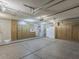 Spacious garage with plenty of storage cabinets along the walls at 13064 N 100Th Pl, Scottsdale, AZ 85260