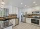 Updated kitchen with stainless steel appliances and granite countertops at 13064 N 100Th Pl, Scottsdale, AZ 85260