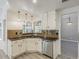 Charming kitchen featuring stainless steel appliances and modern lighting fixtures at 13064 N 100Th Pl, Scottsdale, AZ 85260