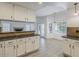 Well-lit kitchen featuring bright cabinets and granite countertops at 13064 N 100Th Pl, Scottsdale, AZ 85260