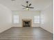 Comfortable living room features laminate flooring and a cozy fireplace at 13064 N 100Th Pl, Scottsdale, AZ 85260
