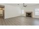 Open living area with fireplace and new wood-look laminate floors at 13064 N 100Th Pl, Scottsdale, AZ 85260