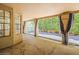 The covered patio offers views of the pool and backyard, enhanced by modern design at 13064 N 100Th Pl, Scottsdale, AZ 85260