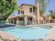 A sparkling pool and spa area surrounded by secure fencing and a covered patio at 13064 N 100Th Pl, Scottsdale, AZ 85260