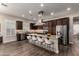 Spacious gourmet kitchen with stainless steel appliances, a gas stovetop, and a breakfast bar at 13448 W Miner Trl, Peoria, AZ 85383