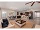 Bright open-concept living space flows seamlessly into a gourmet kitchen and dining area at 13448 W Miner Trl, Peoria, AZ 85383