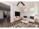 Bright and inviting living room showcases modern furnishings, tile flooring, and abundant natural light at 13448 W Miner Trl, Peoria, AZ 85383
