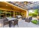 Inviting outdoor patio with pergola, ceiling fans, a dining area, and comfortable seating, perfect for relaxation at 13448 W Miner Trl, Peoria, AZ 85383
