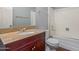 Bathroom featuring a vanity sink with granite countertop and a shower-tub combo at 1385 N 44Th St, Phoenix, AZ 85008