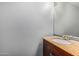 Bathroom features a wood vanity with granite countertop and a mirror for your convenience at 1385 N 44Th St, Phoenix, AZ 85008
