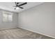 Bright, empty bedroom featuring neutral colored walls and plush carpet, ready for personalization at 1385 N 44Th St, Phoenix, AZ 85008