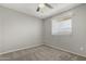 Bedroom with carpet flooring, a ceiling fan, and a window allowing natural light at 1385 N 44Th St, Phoenix, AZ 85008