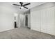 Bedroom with carpet flooring, a ceiling fan, and access to an ensuite bathroom at 1385 N 44Th St, Phoenix, AZ 85008
