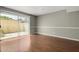 Open-concept living area with hardwood floors, neutral walls and natural light at 1385 N 44Th St, Phoenix, AZ 85008