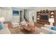 Open concept living room featuring hard wood floors, neutral decor, and cozy seating arrangements at 1385 N 44Th St, Phoenix, AZ 85008