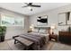 Cozy main bedroom with a comfortable bed, modern decor, and a lot of natural light at 1385 N 44Th St, Phoenix, AZ 85008