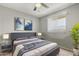 Well-lit main bedroom with large window, soft carpet, and modern decor to create a calming atmosphere at 1385 N 44Th St, Phoenix, AZ 85008