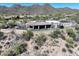 Desert home aerial view showcasing a pool, covered patio, and desert landscaping at 13931 E Via Linda --, Scottsdale, AZ 85259