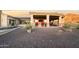 Expansive outdoor living area with a built-in bar, multiple seating areas, and a luxurious pool with water features at 13931 E Via Linda --, Scottsdale, AZ 85259