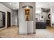 Elegant bathroom showcasing a decorative alcove, custom cabinetry, and travertine tile flooring at 13931 E Via Linda --, Scottsdale, AZ 85259