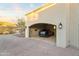 Spacious garage featuring an electric car charger and ample room for vehicle storage and maintenance at 13931 E Via Linda --, Scottsdale, AZ 85259
