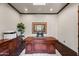 Traditional home office with custom wood desk, hardwood floors, and ample lighting at 13931 E Via Linda --, Scottsdale, AZ 85259