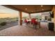 Covered patio with an outdoor kitchen and bar seating, perfect for entertaining with a view of the mountains at 13931 E Via Linda --, Scottsdale, AZ 85259