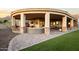 An oversized covered patio featuring an outdoor living room and kitchen space, overlooking desert scenery at 13931 E Via Linda --, Scottsdale, AZ 85259