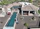 Aerial view of a luxury home with a long lap pool, outdoor kitchen, and covered patio at 13931 E Via Linda --, Scottsdale, AZ 85259