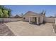 Backyard with covered patio and block wall, perfect for outdoor enjoyment and privacy at 15364 W Acapulco Ln, Surprise, AZ 85379