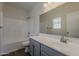 Clean bathroom featuring a tub, toilet, and a large mirror over the vanity at 15364 W Acapulco Ln, Surprise, AZ 85379