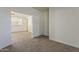 Bedroom featuring neutral walls, carpet and open access to common areas at 15364 W Acapulco Ln, Surprise, AZ 85379