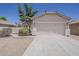 Charming single-story home featuring a neutral facade and a two-car garage at 15364 W Acapulco Ln, Surprise, AZ 85379