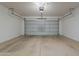 Spacious two-car garage with an automatic door opener at 15364 W Acapulco Ln, Surprise, AZ 85379