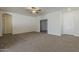 Bright living room featuring neutral walls, plush carpeting, and a ceiling fan at 15364 W Acapulco Ln, Surprise, AZ 85379