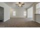 Open-concept living room featuring neutral walls, carpet, and an open plan at 15364 W Acapulco Ln, Surprise, AZ 85379