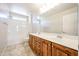 The bathroom has a double vanity, tub/shower combo, and decorative lighting at 16475 N 183Rd Dr, Surprise, AZ 85388