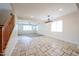 Spacious living area with travertine floors transitions to carpet, connected to the dining area at 16475 N 183Rd Dr, Surprise, AZ 85388