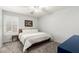 Bedroom featuring a standard bed, neutral tones, a ceiling fan, and a white window with shutters at 16565 W Garfield St, Goodyear, AZ 85338
