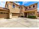 Charming two-story home with a three-car garage, well-maintained landscaping, and a welcoming front entrance at 16565 W Garfield St, Goodyear, AZ 85338