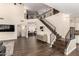 Spacious foyer featuring a staircase with black railing and a view of the upstairs landing at 16565 W Garfield St, Goodyear, AZ 85338