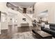 Open foyer with staircase and views into the kitchen and living room at 16565 W Garfield St, Goodyear, AZ 85338