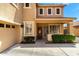 Inviting home exterior with a well-manicured front yard, decorative shrubbery, and an attached garage at 16565 W Garfield St, Goodyear, AZ 85338