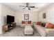 Comfortable upstairs loft area with a ceiling fan and neutral decor at 16565 W Garfield St, Goodyear, AZ 85338