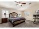 Main bedroom with a vaulted ceiling, neutral color palette, and shuttered windows at 16565 W Garfield St, Goodyear, AZ 85338