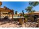 Outdoor patio with BBQ, bar, and covered seating area overlooking pool at 1723 W Mercury Way, Chandler, AZ 85224