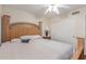 Bedroom with wood floors, neutral paint, closet, window with shutters, and bed with matching end table at 1723 W Mercury Way, Chandler, AZ 85224