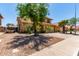 Eye catching home with desert landscaping, tile roof, and an attached two car garage at 1723 W Mercury Way, Chandler, AZ 85224