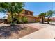 Attractive home with desert landscaping, tile roof, and two car garage at 1723 W Mercury Way, Chandler, AZ 85224