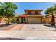Inviting two-story home with a well-manicured lawn and a spacious two-car garage at 1723 W Mercury Way, Chandler, AZ 85224